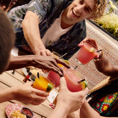 Hands holding Nando's Frozen Cocktails