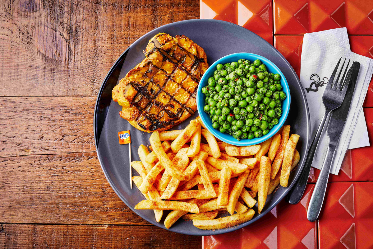 Butterfly Chicken with Nando's Fanta Spice, with PERi chips and macho peas